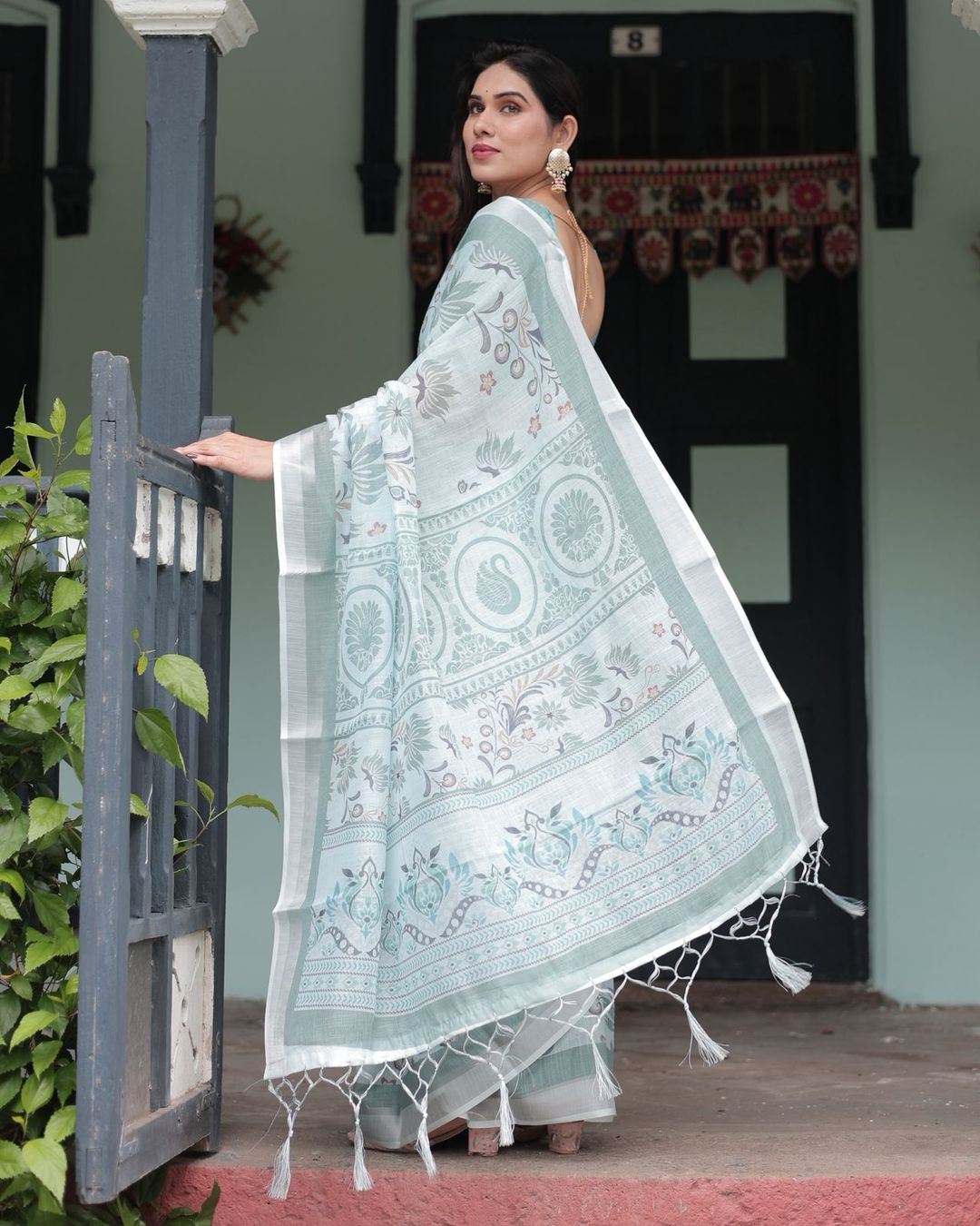 Pastel Green Pure Linen Printed Saree with Tassels