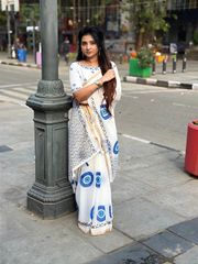 Stylish Linen Saree With Evil Eye Print & Tassels - Cream