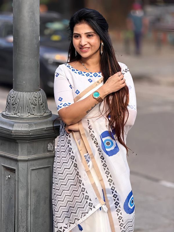 Stylish Linen Saree With Evil Eye Print & Tassels