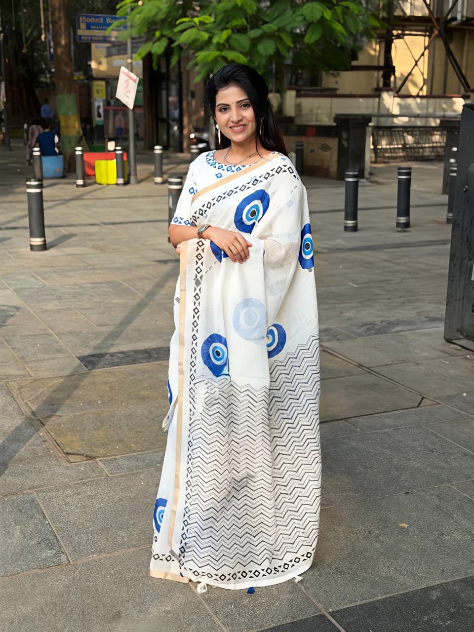 Stylish Linen Saree With Evil Eye Print & Tassels
