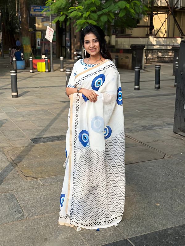 Stylish Linen Saree With Evil Eye Print & Tassels