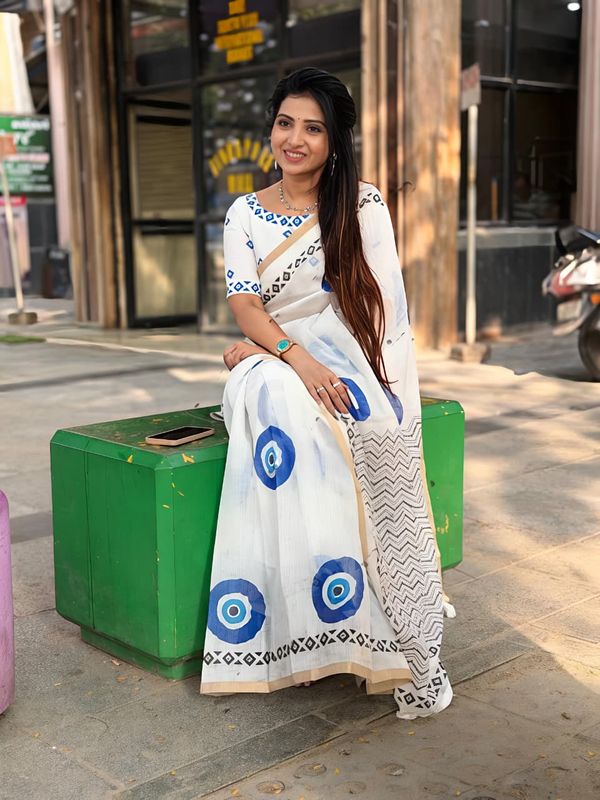 Stylish Linen Saree With Evil Eye Print & Tassels