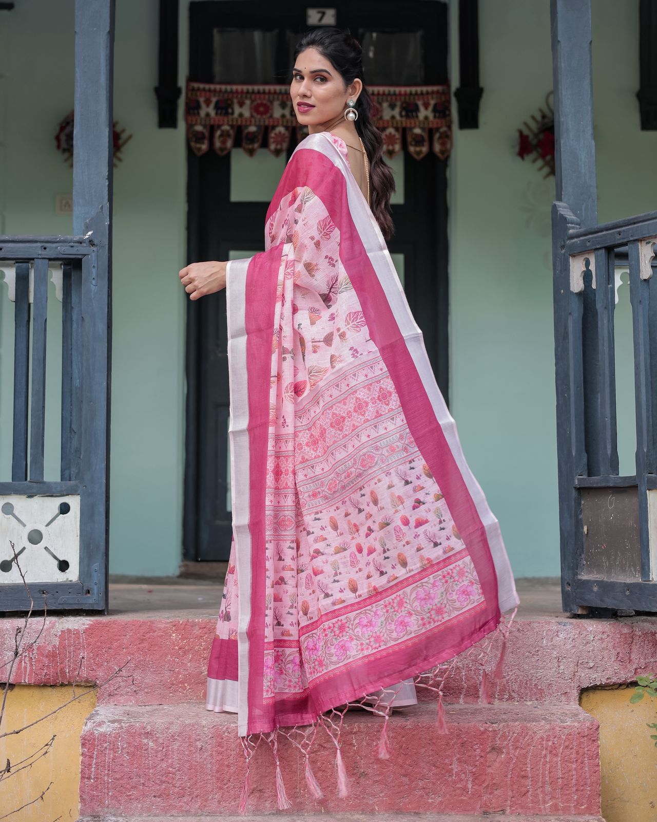 Soft Pink Floral Linen Saree with Elegant Border