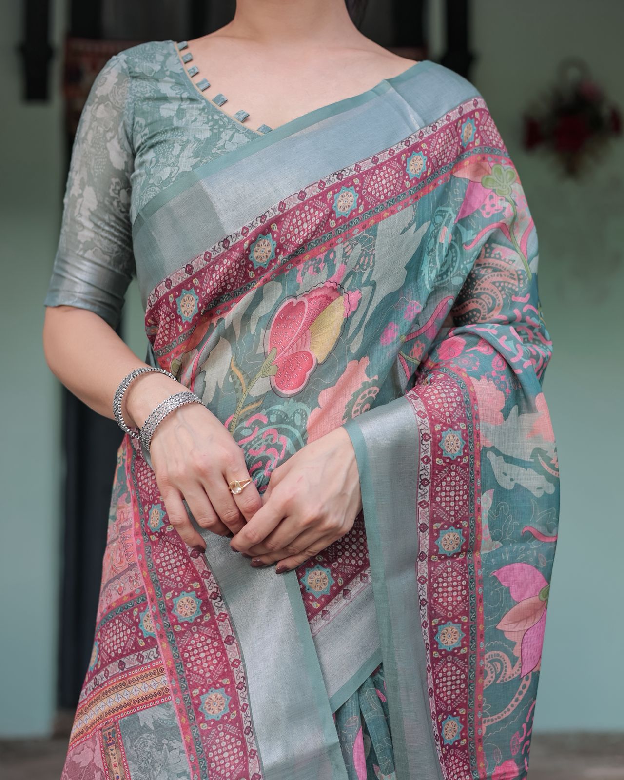 Teal Green Printed Linen Saree with Ethnic Border