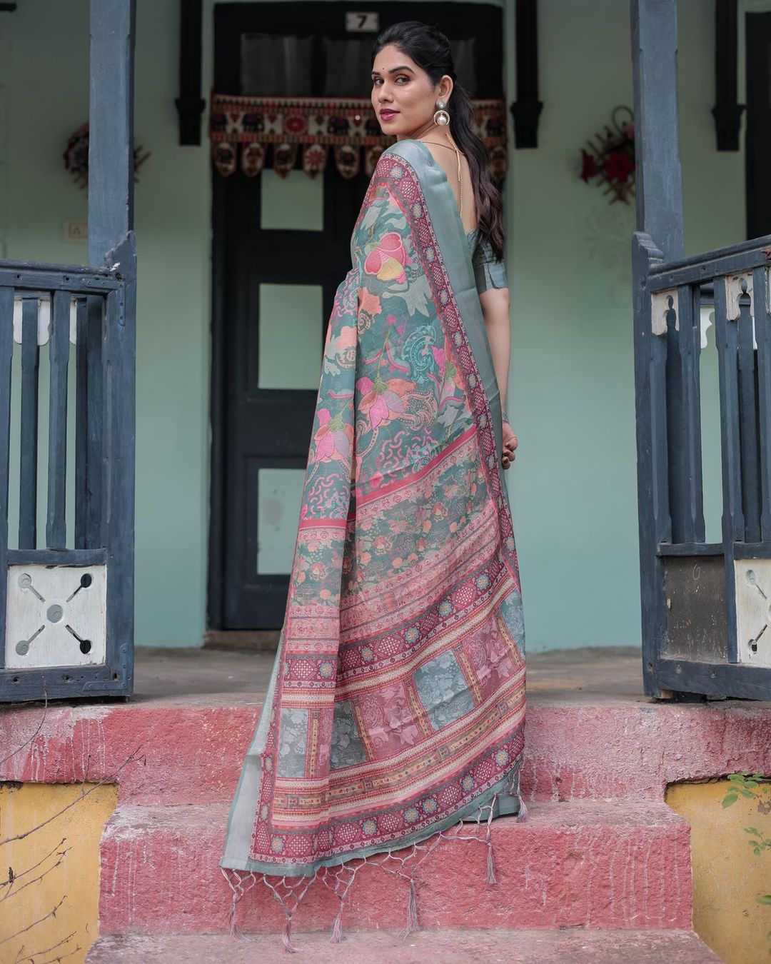 Teal Green Printed Linen Saree with Ethnic Border
