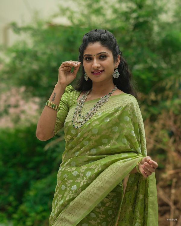 Festive Green Banarasi Saree with Subtle Zari Motifs