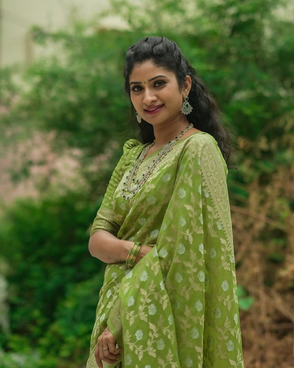 Festive Green Banarasi Saree with Subtle Zari Motifs