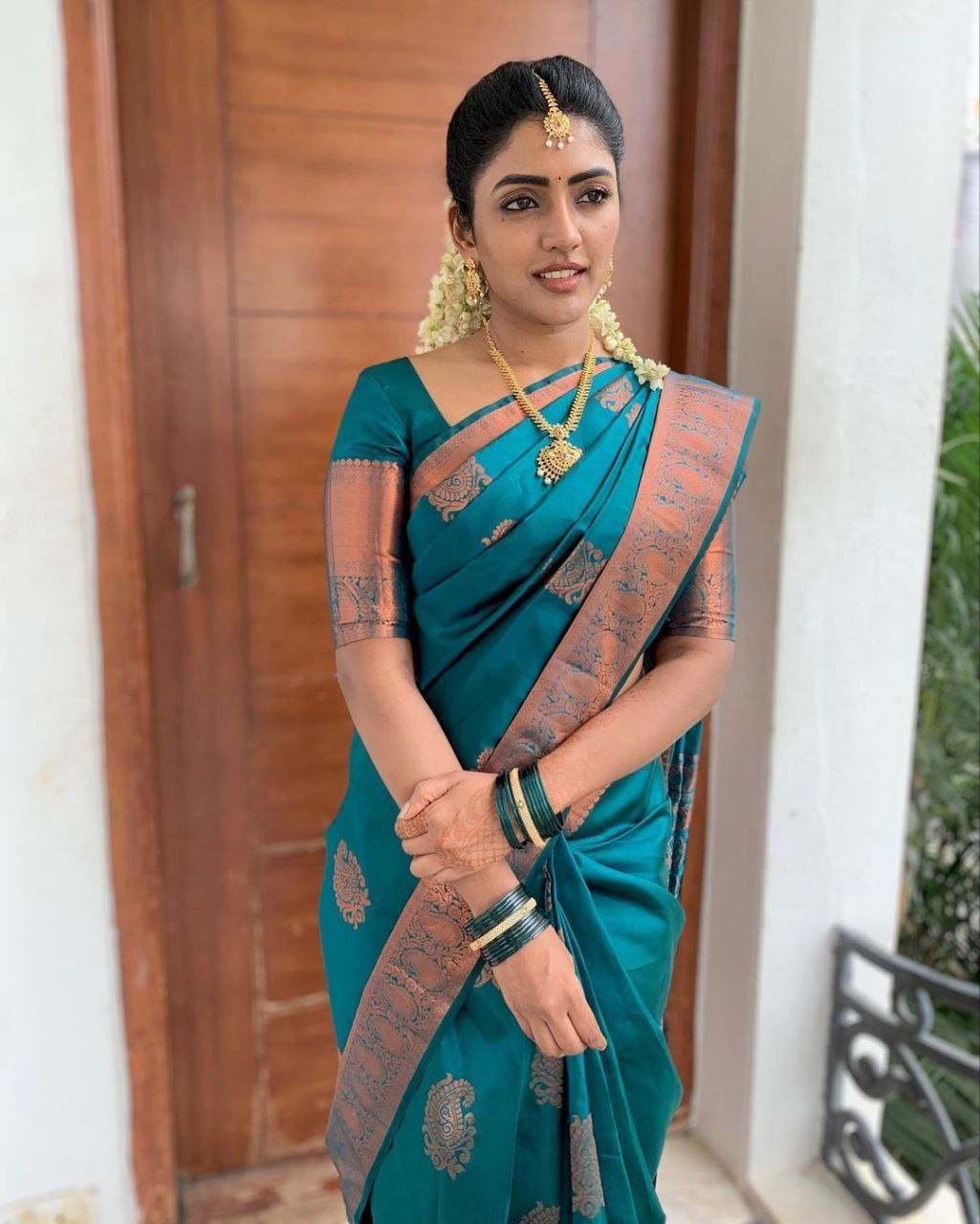 Festive Teal Banarasi Saree with Traditional Motifs