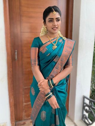 Festive Teal Banarasi Saree with Traditional Motifs